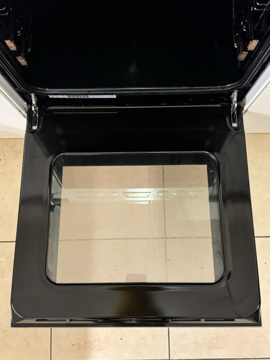 The same oven at the end of the job, door open and glass clear